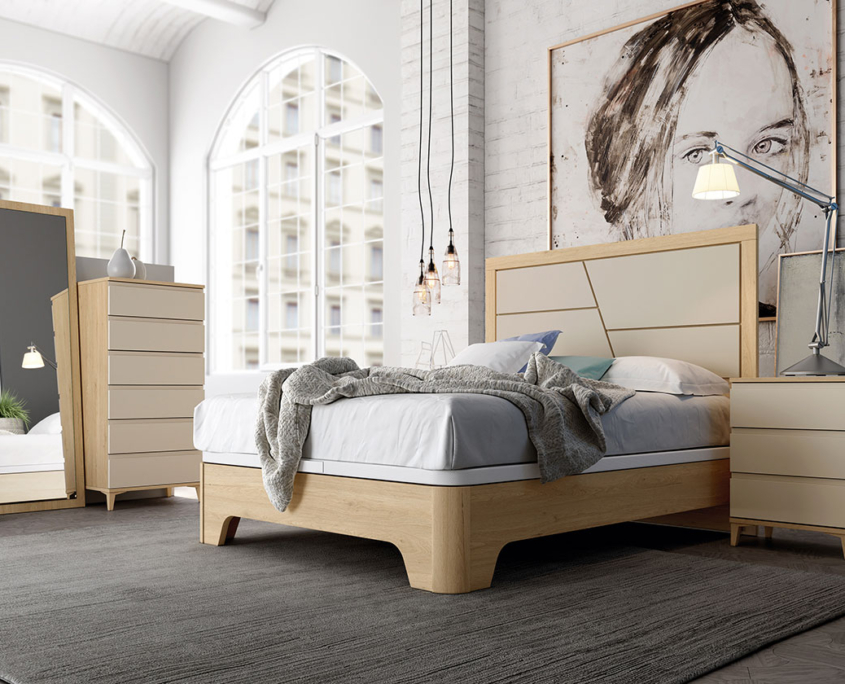 Mobiliario del hogar - cama con cuadro de cara en el fondo